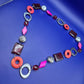 Statementkette mit geometrischen Elementen Pink Orange Braun