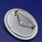 Auffällige Vintage Brosche mit schillerndem Glas-Cabochon und Schmucksteinen