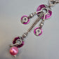Exklusive Statement Kette in Violett und Silberfarben mit Perlenanhänger