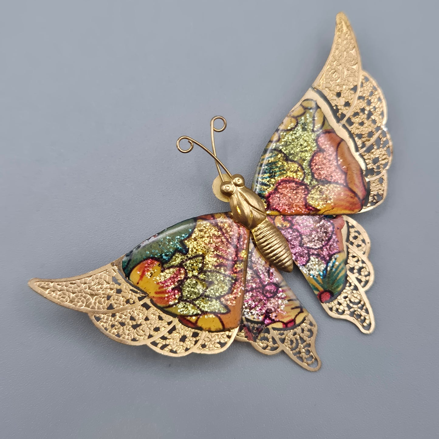 Vintage Schmetterlingsbrosche mit glitzernden Emaille Akzenten