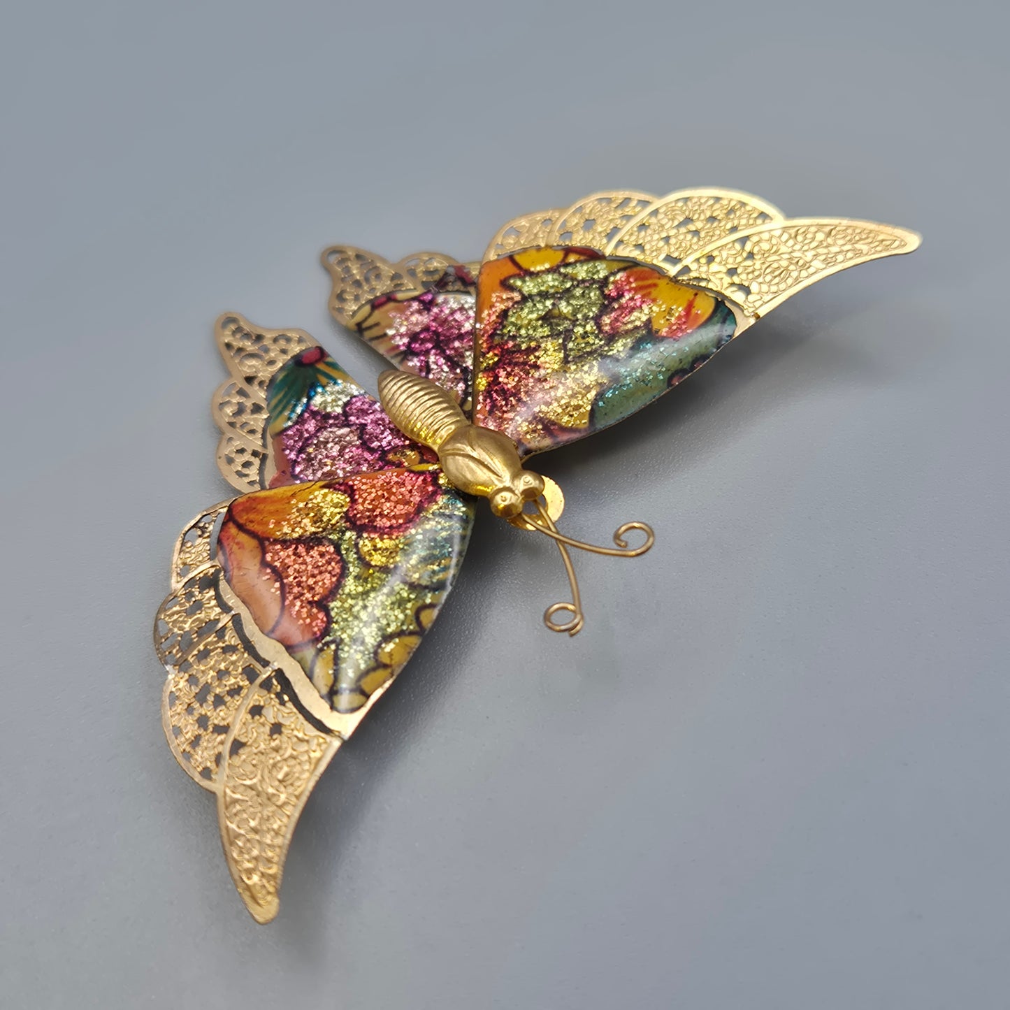 Vintage Schmetterlingsbrosche mit glitzernden Emaille Akzenten