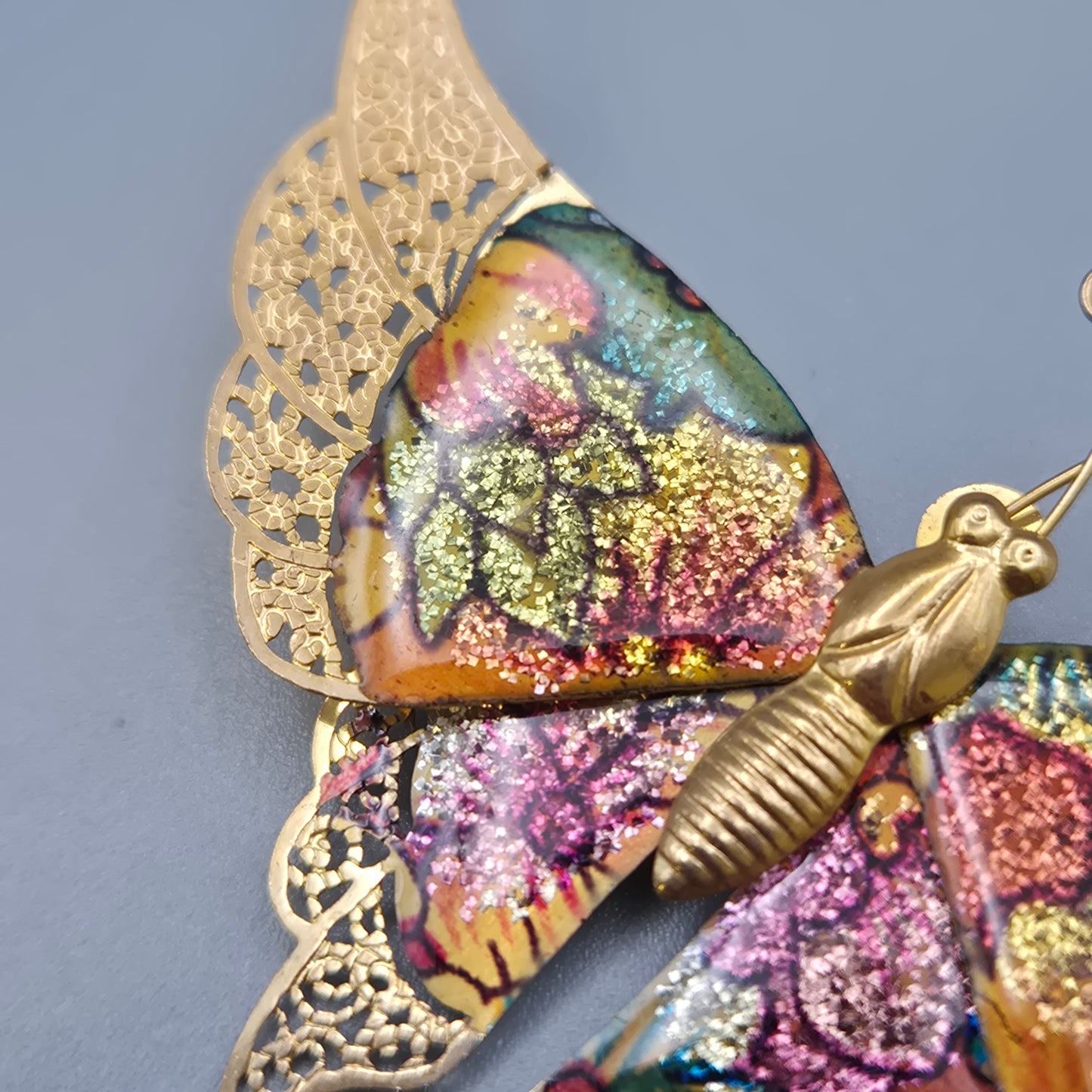 Vintage Schmetterlingsbrosche mit glitzernden Emaille Akzenten