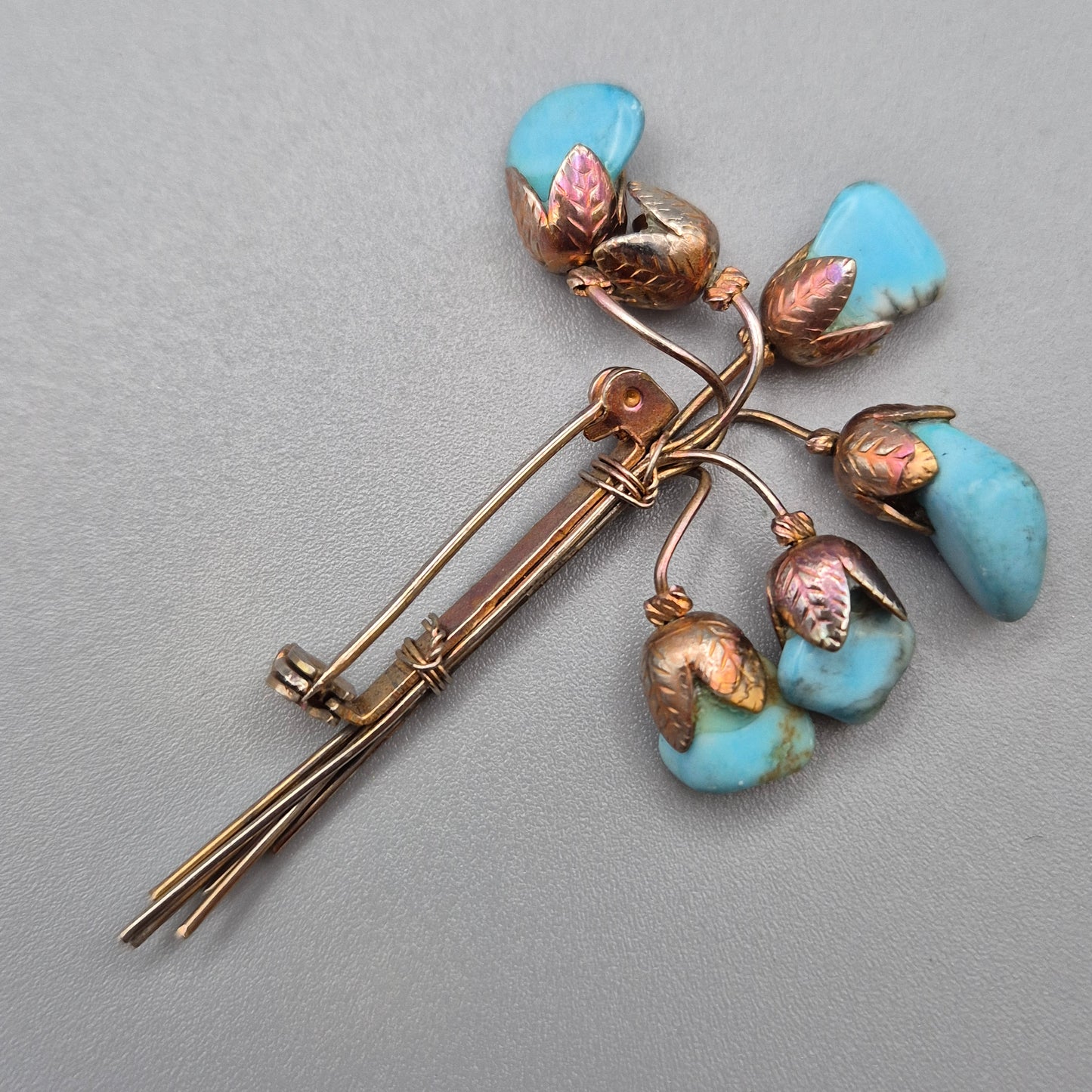 Vintage Blumen Brosche mit Türkis Steinen Goldfarben