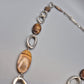 Vintage Kette mit ovalen Elementen in braunem Perlmutt-Look und silbernen Gliedern