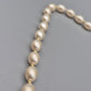 Elegante Vintage Perlenkette mit ovalen Perlen weiß