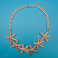 Goldfarbene Seestern Statement Kette im maritimen Design