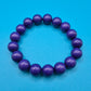 Violettes Perlenarmband aus geschliffenen Kunststoff-Edelsteinen