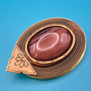 Vintage Brosche mit Tigerauge Cabochon & filigraner Metall-Ornamentik