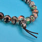 Vintage Glasperlen-Armband mit bunter Einlage und Kordelzug