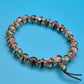 Vintage Glasperlen-Armband mit bunter Einlage und Kordelzug