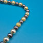 Elegante Vintage-Kette mit grauen Perlen und goldenen Elementen