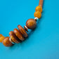 Boho-Statement Kette mit Holzperlen und bernsteinfarbenen Akzenten