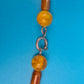 Boho-Statement Kette mit Holzperlen und bernsteinfarbenen Akzenten