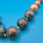 Vintage Statement-Kette mit marmorierten Kugeln in Bronze und Türkis