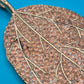 Vintage Blatt-Anhänger in Roségold-Optik mit funkelnden Strasssteinen