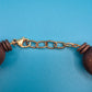 Vintage Statement-Kette Holzperlen mit zentralem Riffel-Element Boho Chic