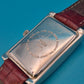 Elegante TCM Armbanduhr in rechteckiger Form mit weinrotem Lederarmband