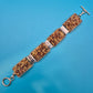 Vintage Armband gewebt mit Glasperlen und Knebelverschluss in Braun-Gold