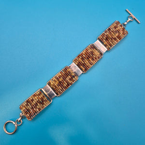 Vintage Armband gewebt mit Glasperlen und Knebelverschluss in Braun-Gold