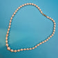 Elegante Vintage Perlenkette mit Akzent-Edelsteinen und Goldverschluss