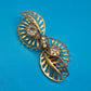 Vintage Art Deco Stil Brosche in Goldoptik mit geschliffenen Zirkonia-Steinen
