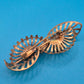 Vintage Art Deco Stil Brosche in Goldoptik mit geschliffenen Zirkonia-Steinen