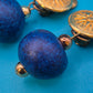 Vintage Ohrclips mit goldfarbenem Sonnen-Motiv und blauen Perlen