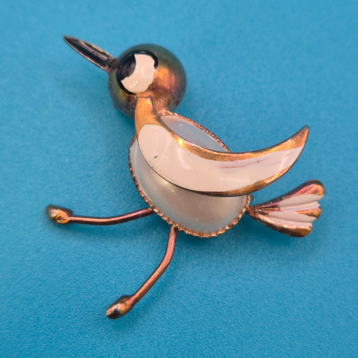 Vintage Vogel-Brosche in Goldoptik mit Emaille-Akzenten und Perlmutt-Optik