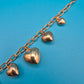 Vintage Roségoldfarbenes Bettelarmband mit Herz-Anhängern