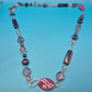 Elegante Vintage-Kette in Violett- und Fliedertönen mit geometrischen Perlen