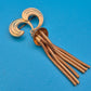 Vintage Goldfarbene Brosche mit Schlangenkettchen-Quaste
