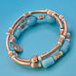 Vintage Wickelarmband in Hellblau mit Charm-Details und goldenen Elementen