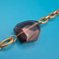 Elegante Vintage Goldfarbene Kette mit facettierten Schmucksteinen