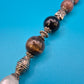 Boho-Kette mit Halbedelsteinen, Charm-Anhängern und verspielten Details