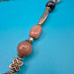 Boho-Kette mit Halbedelsteinen, Charm-Anhängern und verspielten Details