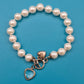 Vintage Perlenarmband mit Herz-Charms und Kristallanhänger