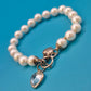 Vintage Perlenarmband mit Herz-Charms und Kristallanhänger