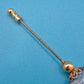 Vintage Hutnadel mit kunstvoll gemusterter Glasperle & Gold-Finish