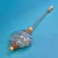 Vintage Hutnadel mit kunstvoll gemusterter Glasperle & Gold-Finish
