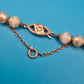 Elegante Vintage Perlenkette mit kunstvoller Schließe – Klassischer Chic