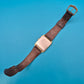 Elegante Vintage EM Quartz Armbanduhr mit Struktur-Zifferblatt Goldfarben