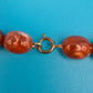 Vintage Statement-Kette mit braunen Glanzperlen und goldenen Akzenten