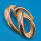 Elegante Vintage-Brosche in geschwungener Knoten-Optik, Goldfarben