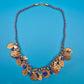 Vintage Statement-Kette mit floralen Anhängern und blauem Textilband