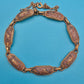 Vintage Armband mit gravierten Metallgliedern und goldenen Ornamenten