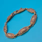 Vintage Armband mit gravierten Metallgliedern und goldenen Ornamenten