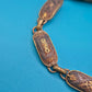 Vintage Armband mit gravierten Metallgliedern und goldenen Ornamenten