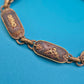Vintage Armband mit gravierten Metallgliedern und goldenen Ornamenten