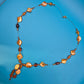 Elegante Y-Kette mit honigfarbenen Perlmutt- und Glasperlen