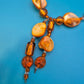 Elegante Y-Kette mit honigfarbenen Perlmutt- und Glasperlen